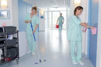 Healthcare workers cleaning a healthcare building
